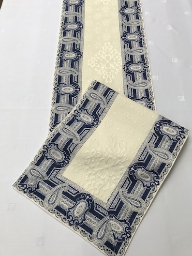 table runner with blue and white forders